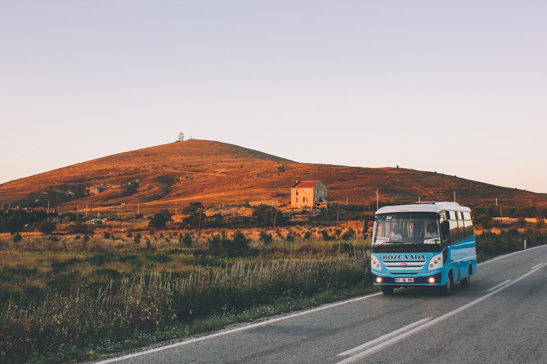 Services Sunset on the beautiful little island Bozcaada in Turkey. A bus passes by the islands radar unit.
